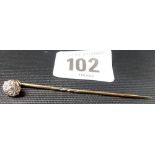 Gold and diamond cluster tie pin, the head claw set with a central stone of 0.10 spread approx