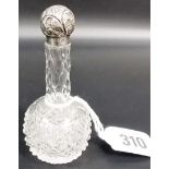 Small Victorian silver lid cut glass perfume bottle, the ovoid foliate embossed screw lid over an