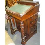 Victorian rosewood Davenport, the hinged top with writing inset revealing birds eye maple veneered