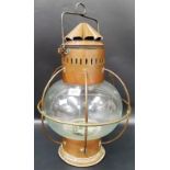 Large copper and ovoid glass ships lamp with three handles and fluted chimney, height 17'