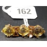 Yellow metal three stone citrine bar brooch width 40mm