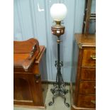 Wrought iron and copper reservoir adjustable standard oil lamp, with white opaque ovoid shade,