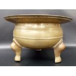 Large Chinese brass ding with flared rim raised on three shaped legs, diameter 16.5'.