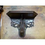 Black Forest carved pine wall bracket, carved with a goat head, height 10'