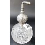 George V silver and cut glass ovoid atomiser, the ovoid silver mount foliate scroll embossed,