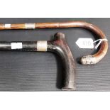 Silver mounted Malacca walking cane; together with an ebonised walking stick with silver collar,