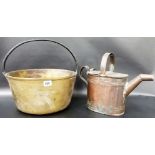 Brass preserve pot together with a copper watering can.