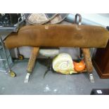 Vintage leather vaulting horse upon four wooden adjustable legs, length 62'