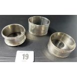 Two silver napkin rings, together with a silver plated napkin ring, weight of silver 1.75oz approx