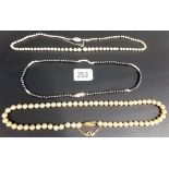 Three pearl necklaces, one with 925 gilt clasp