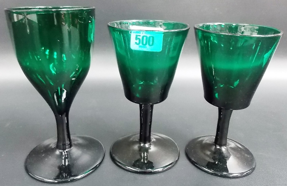 Pair of George III Bristol green glass stemmed wine glasses and one other
