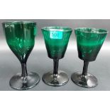 Pair of George III Bristol green glass stemmed wine glasses and one other