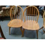Pair of Blonde Ercol hoop and stick back dining chairs