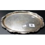Pre-War silver oval tray by Mappin & Webb, foliate scroll engraved and with a serpentine border,