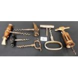 Seven various antique corkscrews