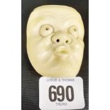 Japanese carved ivory grotesque mask with bulging eyes, height 2'