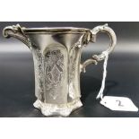 Victorian silver cream jug, the faceted sides with leaf scrolls upon a scroll cast foot and later