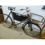 A vintage butcher's bike with front basket