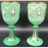Good pair of 19th Century Bohemian green opaque overlay cut glass goblets, the bowl with oval cut