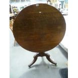 George III Oak circular tilt top tripod table, upon turned pedestal and three 'Regency Knee'