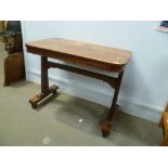 Good Regency rosewood writing table, the top with egg and dart beading to the edge, upon rectangular