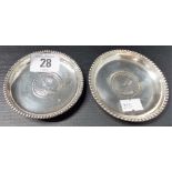 Pair of Indian white metal circular pin dishes inset with a rupee dated 1913 and 1914, one