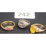 9ct citrine set dress ring; a yellow metal three stone ring (two stones missing),together with a