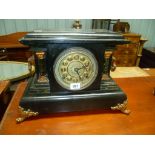Black painted slate and marbel simulated three train mantle clock with 5' brass circular dial and