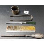 Five pieces of silver including a napkin ring, a pair of sugar tongs, a hair comb, buttonhook and