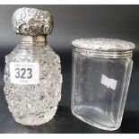 Silver cut glass ovoid scent bottle, the foliate embossed lid over the silver rim and stopper;