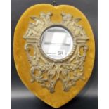 Small wall mirror with circular plate framed by brass cast and pierced strapwork surrounded by