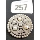 Attractive Belle Epoque diamond, pearl and platinum circular brooch, the central diamond of 0.20ct
