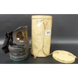 WWII child's gas mask in original cylindrical in container.