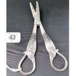 Good pair of George V silver grape scissors, the reeded handles with harebell and ribbon swags,