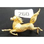 Unusual 18k gold brooch, modelled as a leaping horse, the back stamped 18k, length 2' approx, weight