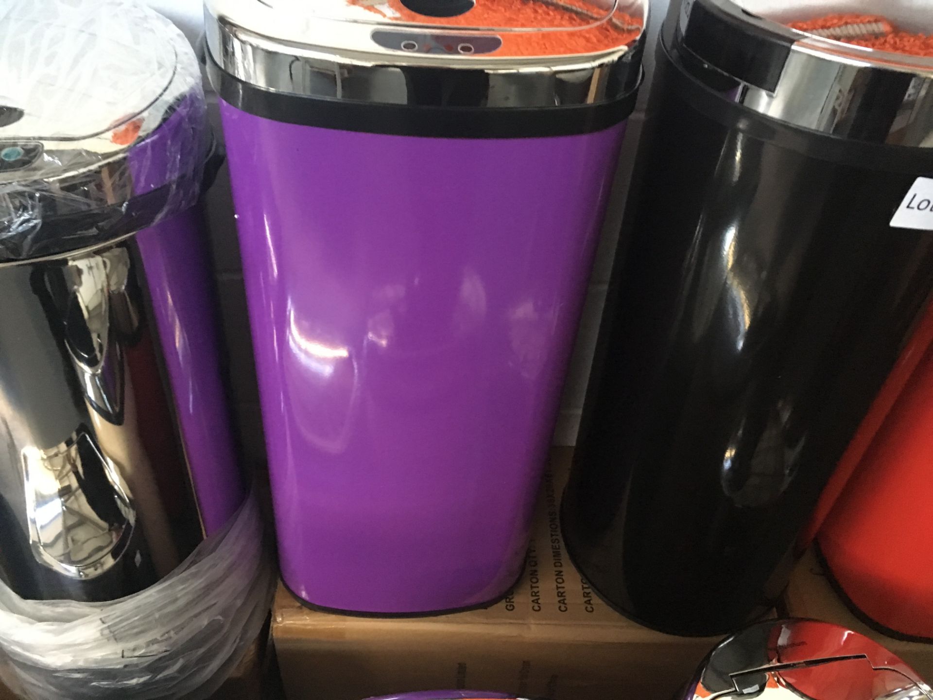 Square purple 42 litre touch sensor bin. Small dent to rear. Customer return.