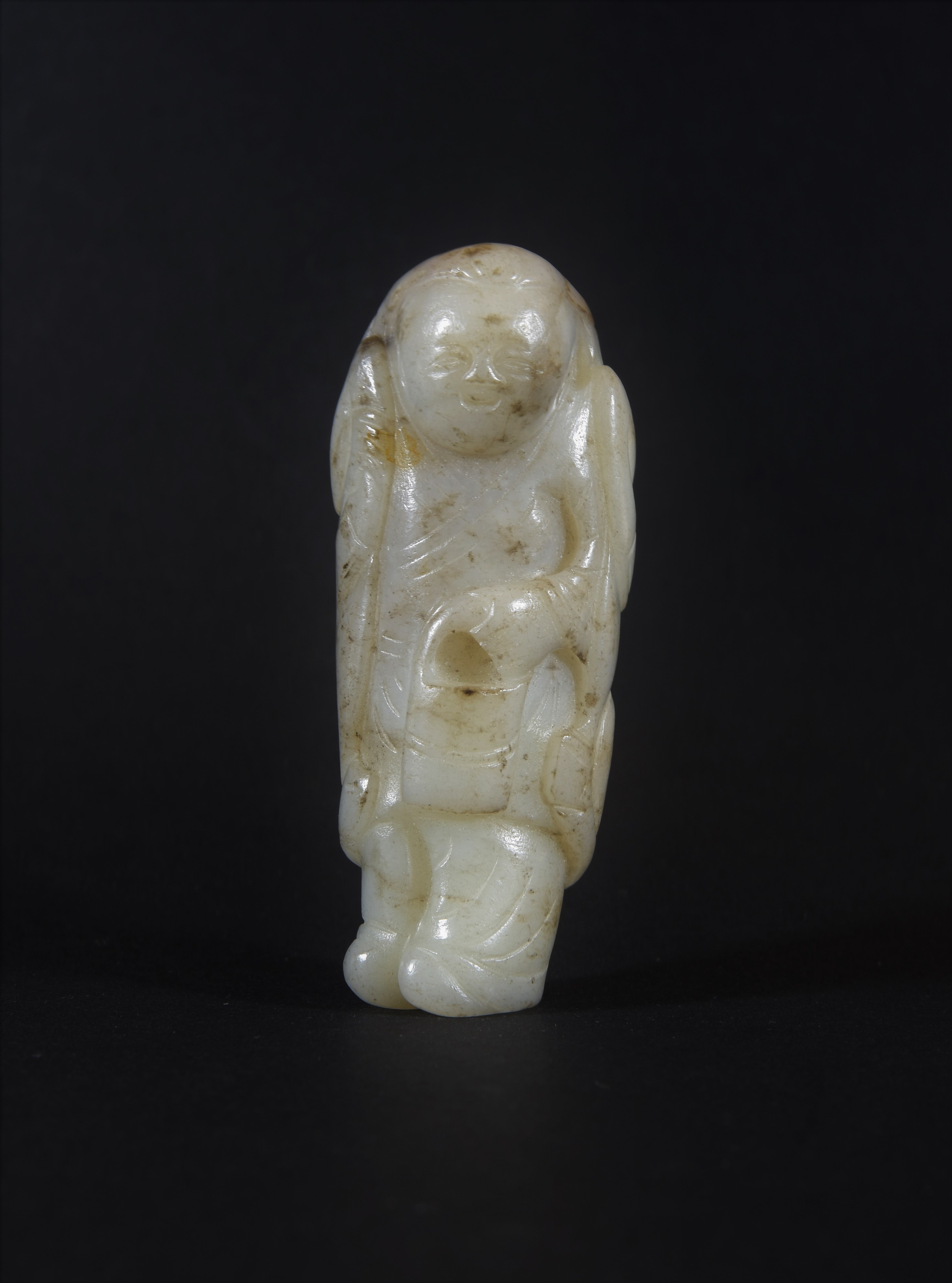 A celadon jade figure 青白玉雕童子珮件