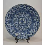 A Kangxi blue and white dish with flowers in twelve panels 39cm清 康熙時期 青花十二花神碟