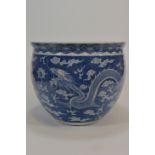 A 19th century blue and white jardiniere with two dragons 26cm diameter清 十九世紀 青花雙龍花盆