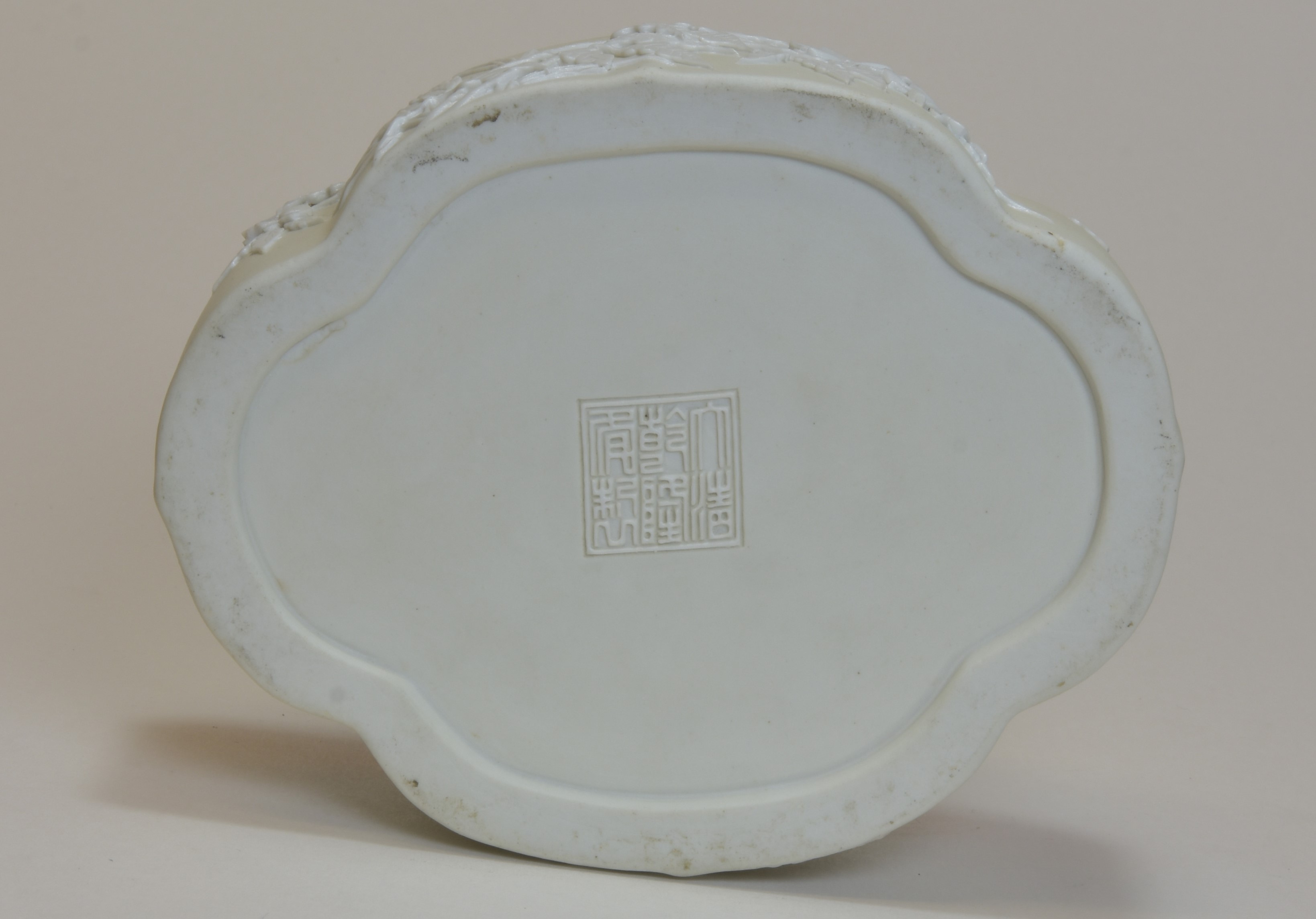 A 19th Century carved white biscuit porcelain with - Image 2 of 2