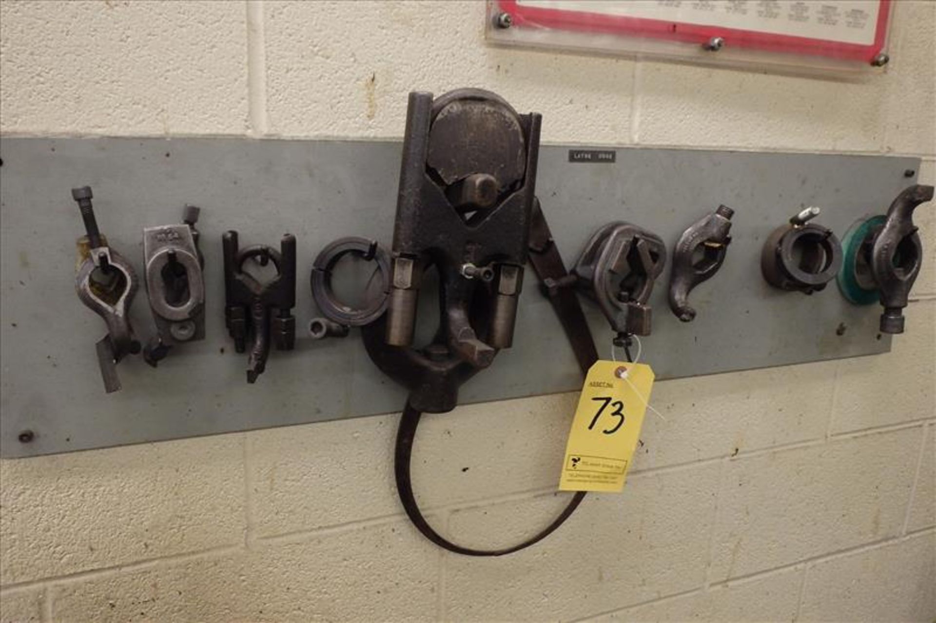 Quantity of Assorted Clamps on Wall (P)