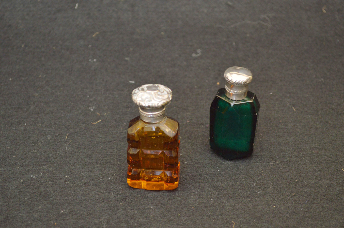 A Silver Mounted Glass Perfume Bottle and a Silver Mounted Green Glass Perfume Bottle