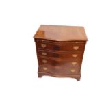 A Mahogany Four Drawer Shaped Front Chest with Dressing Slide