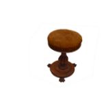 A Circular Mahogany Upholstered Revolving Stool