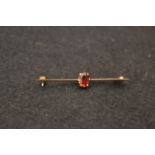 A 9ct Gold and Garnet Bar Brooch