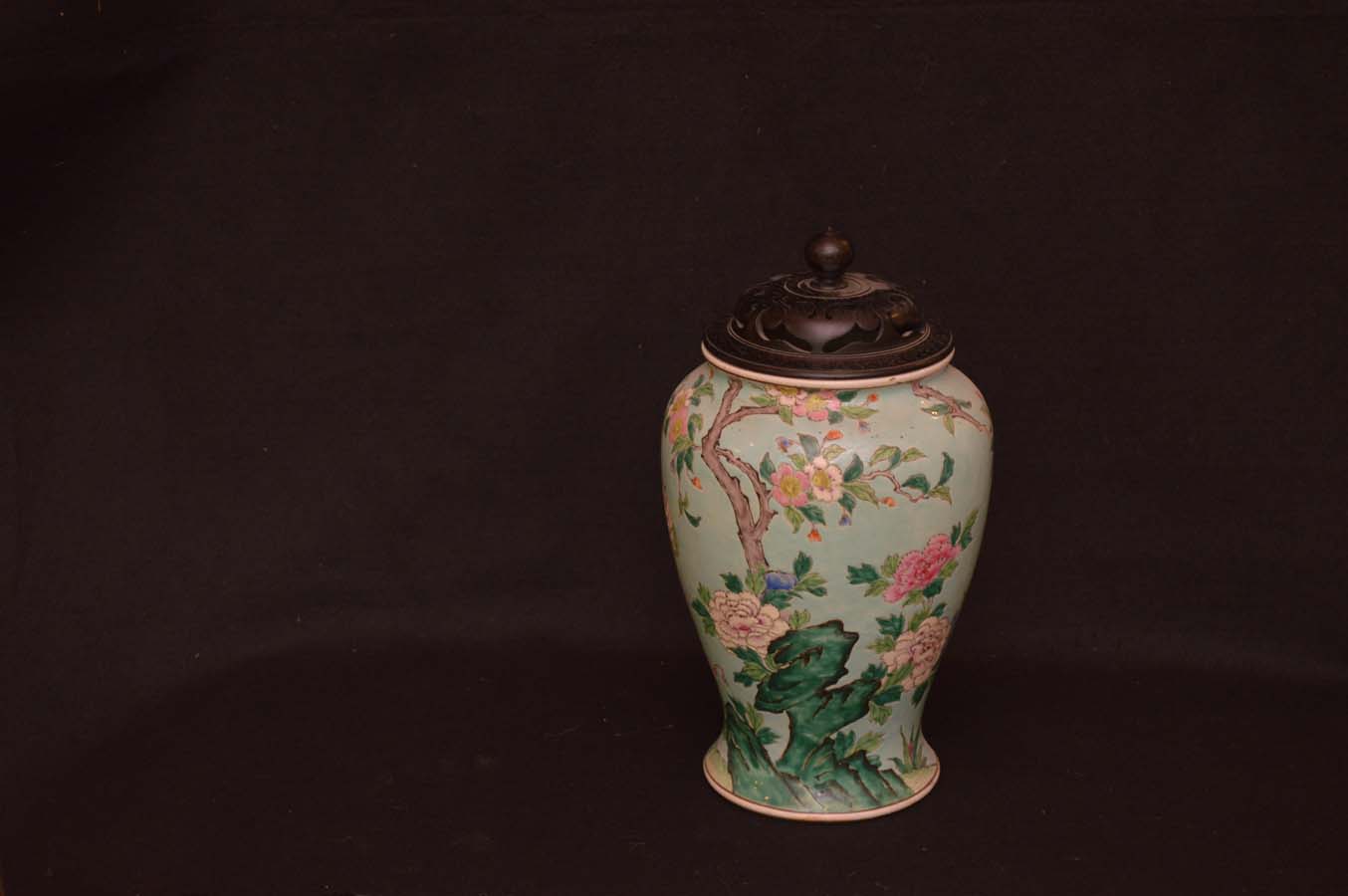 An Early Oriental Lidded Vase on Hardwood Stand