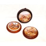 A Set of Three Framed Pot Lids