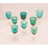 A Collection of Green Glass Footed Drinking Glasses