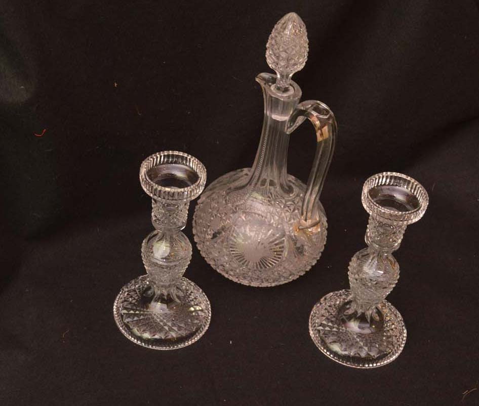 A Crystal Decanter and a Pair of Crystal Candlesticks