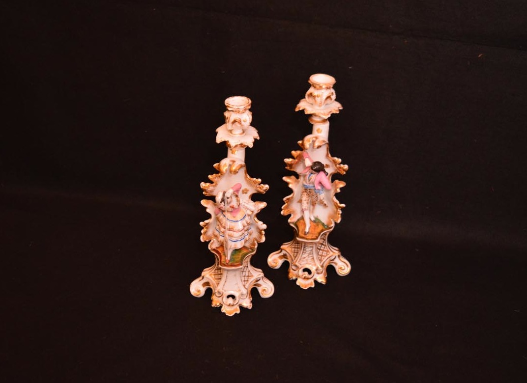 A Pair of Early Porcelain Figurine Candlesticks